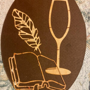 a beautiful bookmark made from birch bark, featuring a glass of wine, open book, and feather design