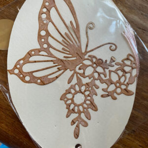 a beautiful bookmark made from birch bark, featuring a butterfly with flower design