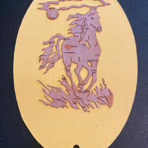 a beautiful bookmark made from birch bark, featuring a running horse on the grass design
