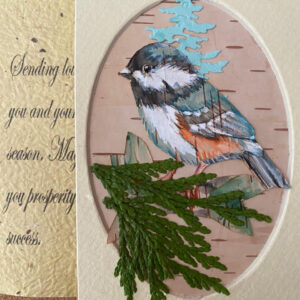 This handmade watercolor card beautifully captures the essence of winter with its stunning depiction of a bird perched amidst nature.